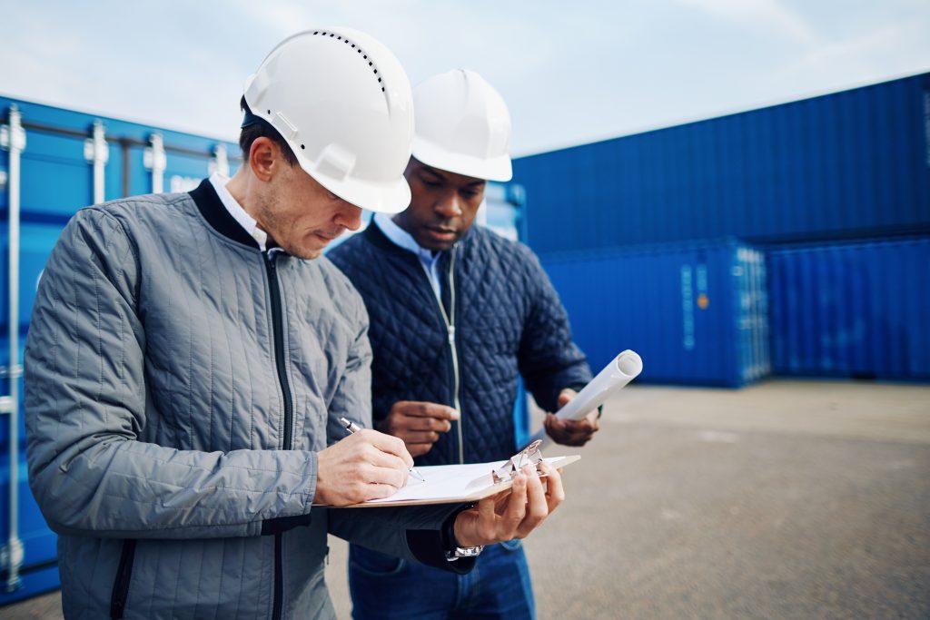 two engineers standing in a shipping yard discussi 2022 02 02 03 47 55 utc
